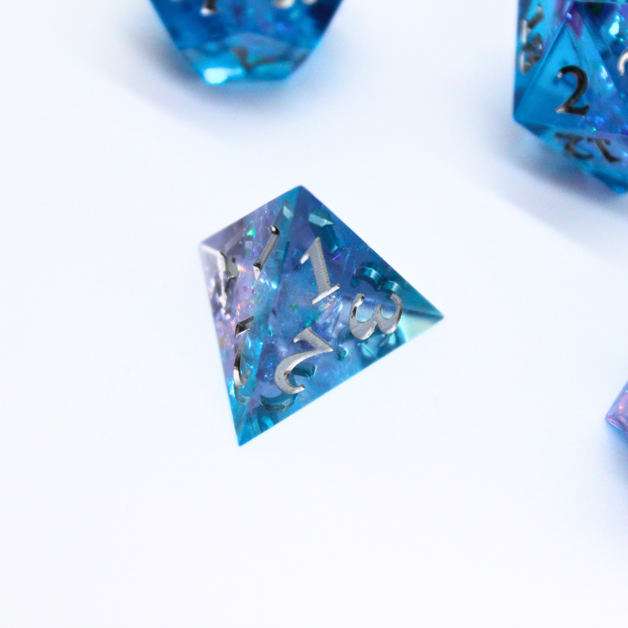 Close-up of blue polyhedral dice on a white background