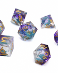 Set of purple and blue polyhedral dice with gold numbers on a white background