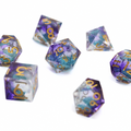Set of purple and blue polyhedral dice with gold numbers on a white background